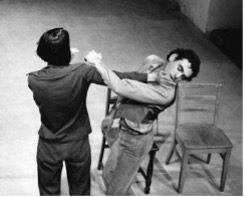 Yvonne Rainer “this is the story of a woman who… “ [Slow Motion Fight :Yvonne hist John on his chin]